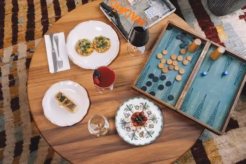Hotel table showing spanish tapas and board games