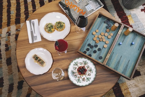 Hotel table showing spanish tapas and board games