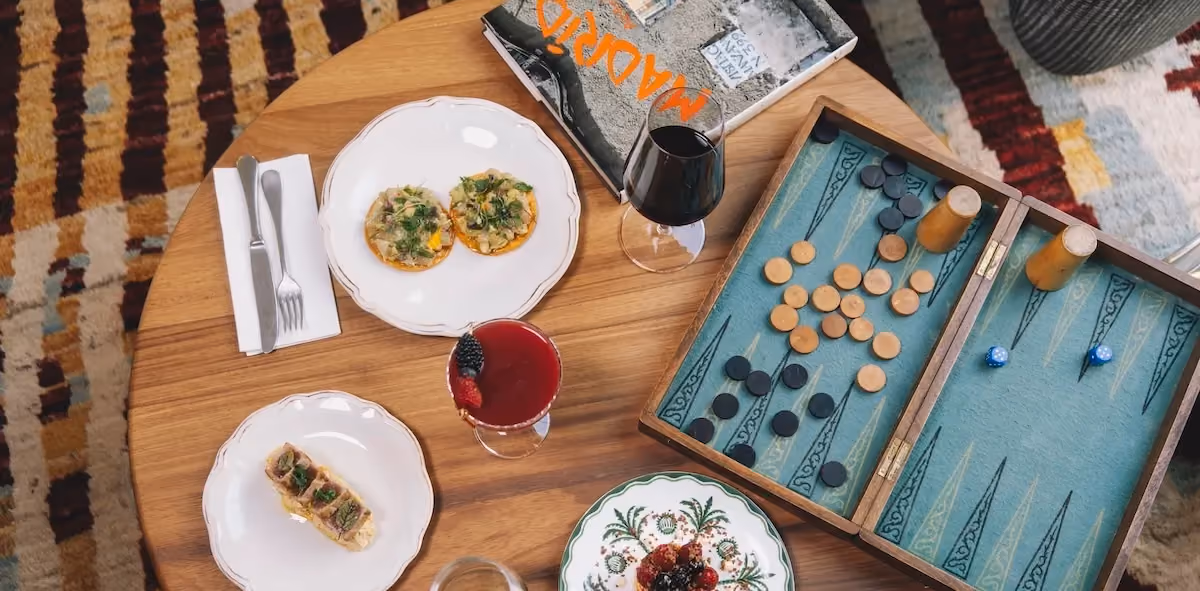 Hotel table showing spanish tapas and board games