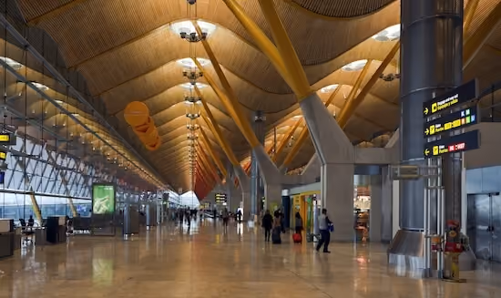 Madrid-Barajas Airport terminal, with the exit sign visible on the right