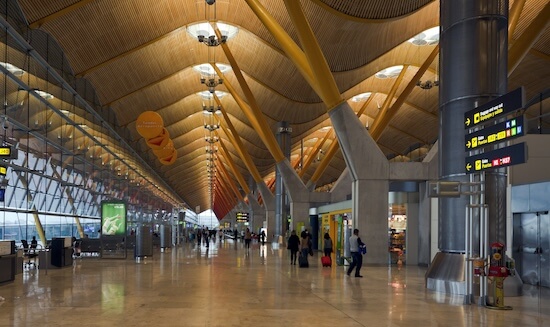 Madrid-Barajas Airport terminal, with the exit sign visible on the right