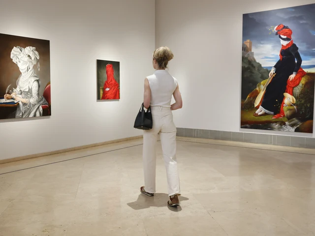 Visitor viewing Ewa Juszkiewicz paintings at the Museo Thyssen-Bornemisza, Madrid