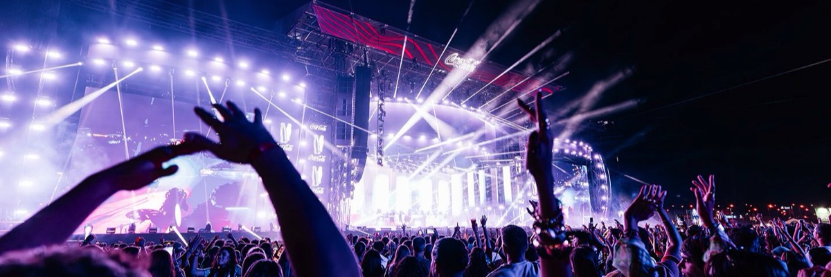 Coca-Cola Music Experience crowd enjoying a live concert in Madrid at night.