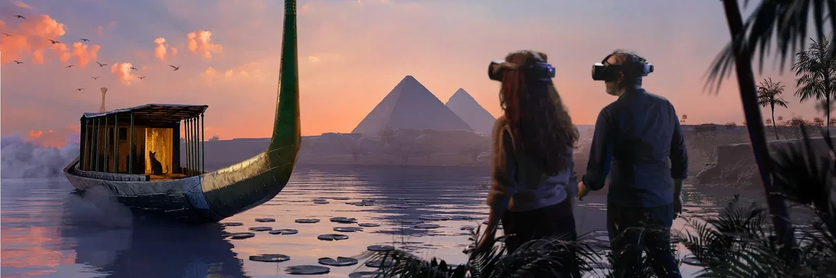 VR visitors beside an ancient Egyptian boat, facing the Giza pyramids at sunset