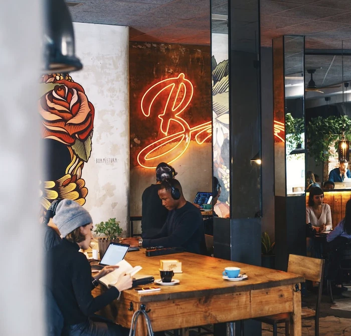 People reading and working at La Bicicleta Café in Malasaña.
