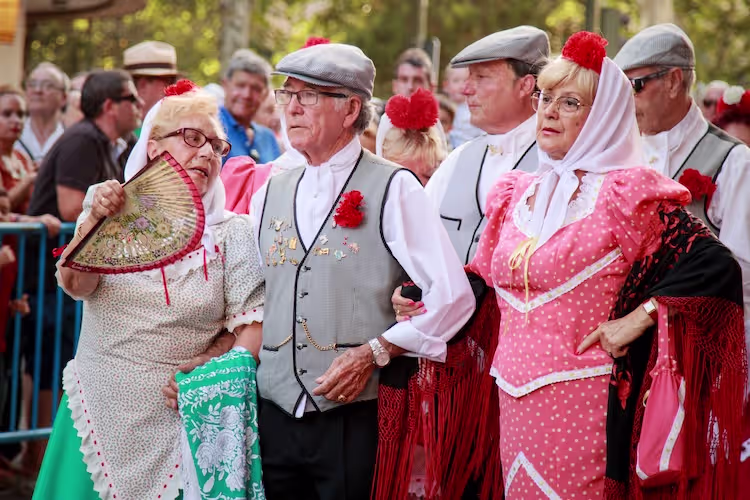 People in traditional dresses at the Virgen de la Paloma festival in Madrid