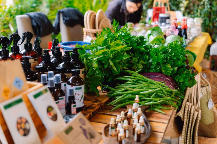 Close up of a exhibitor at BioCultura selling fresh herbs and organic products
