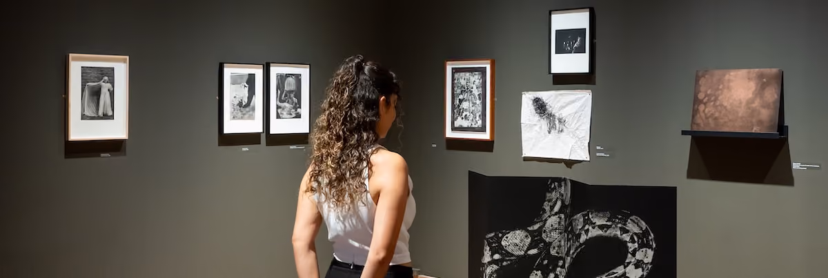 Woman at the La Muerte Nuestra de Cada Día exhibition at Casa México