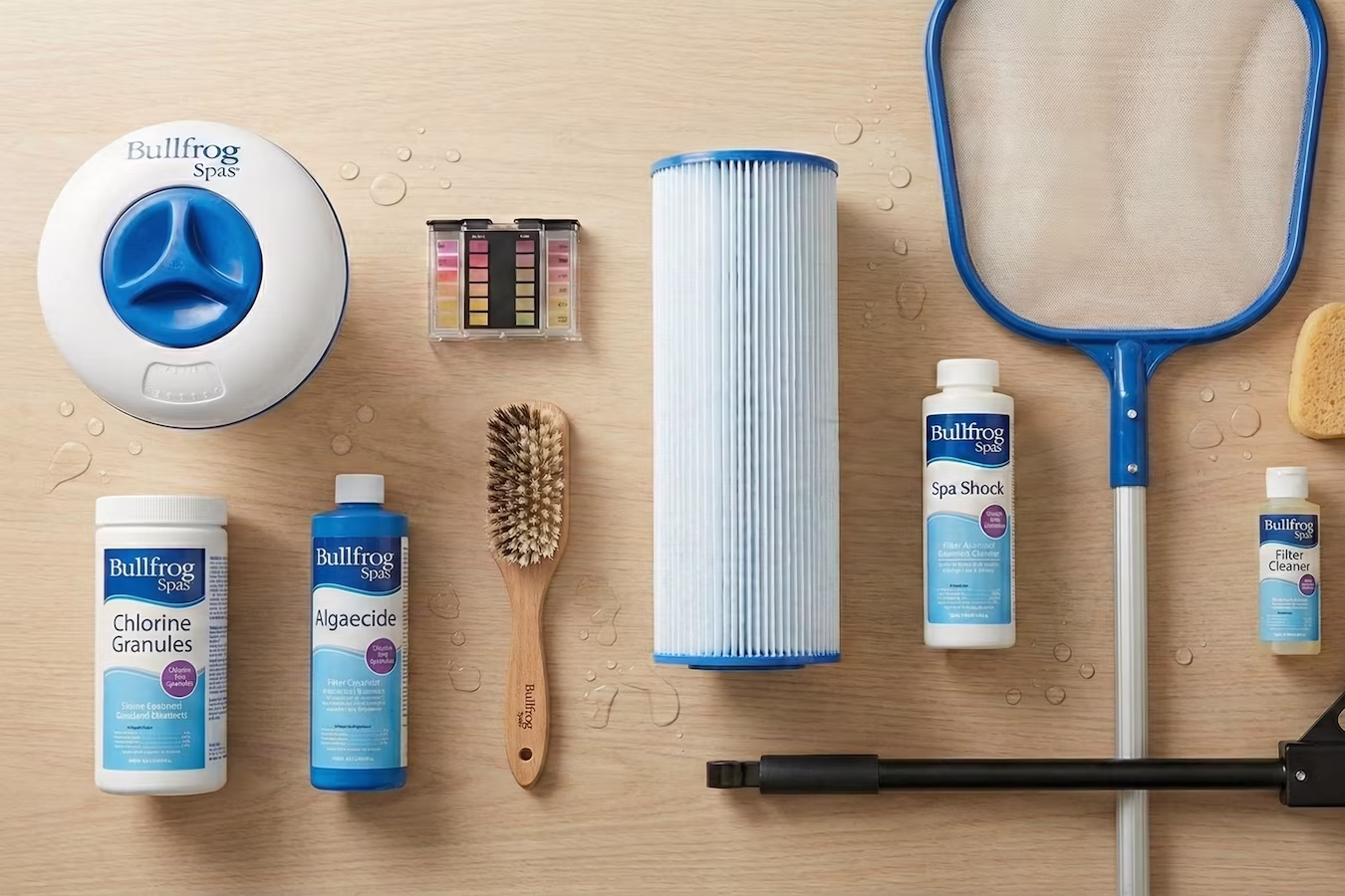 A set of Bullfrog Spas maintenance accessories laid out on a wooden surface.