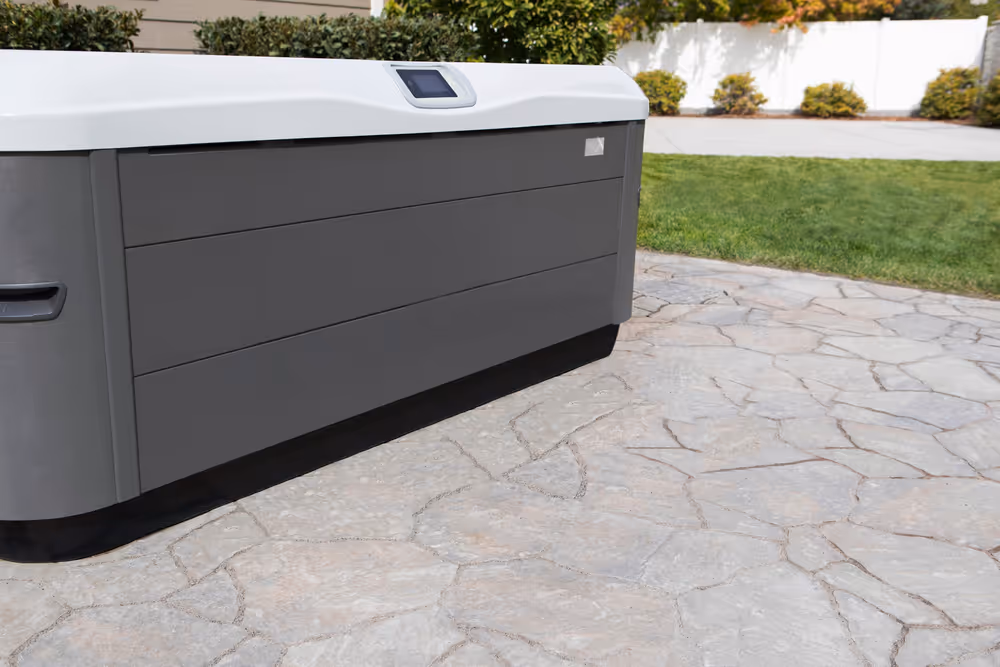 An exterior angle view of an X Series spa with open cover.