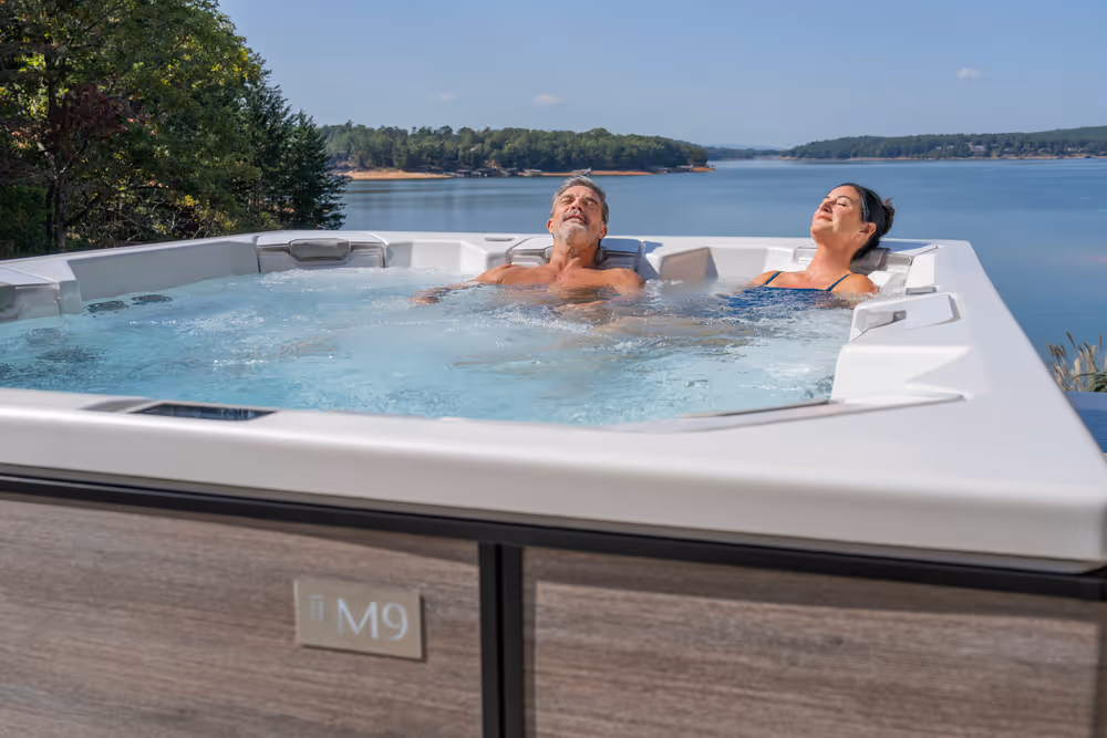 A couple enjoying individual JetPak therapy in the M9 spa.