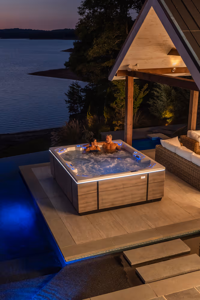 Two people relaxing in the M9 spa's multi-lounge layout.