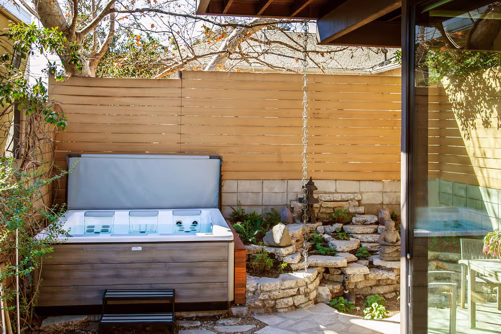 The STIL7 spa in a residential backyard.