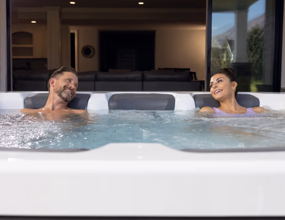 A couple relaxing together in an A Series spa.