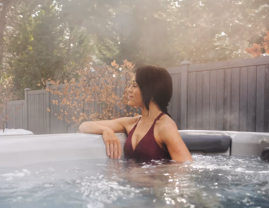A woman relaxing alone in an A Series spa.