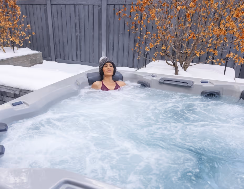 A woman relaxing alone in an A Series spa.