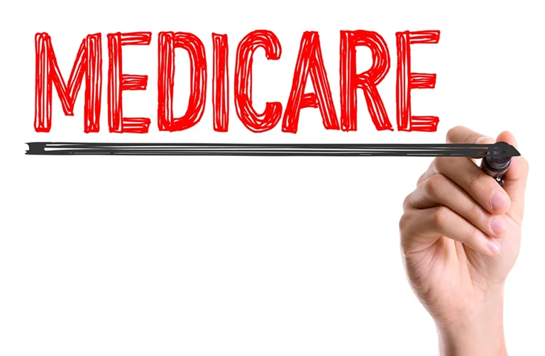 someone writing the word "medicare"