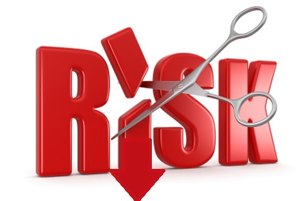 the word "Risk" with the "i" being cut in half by scissors