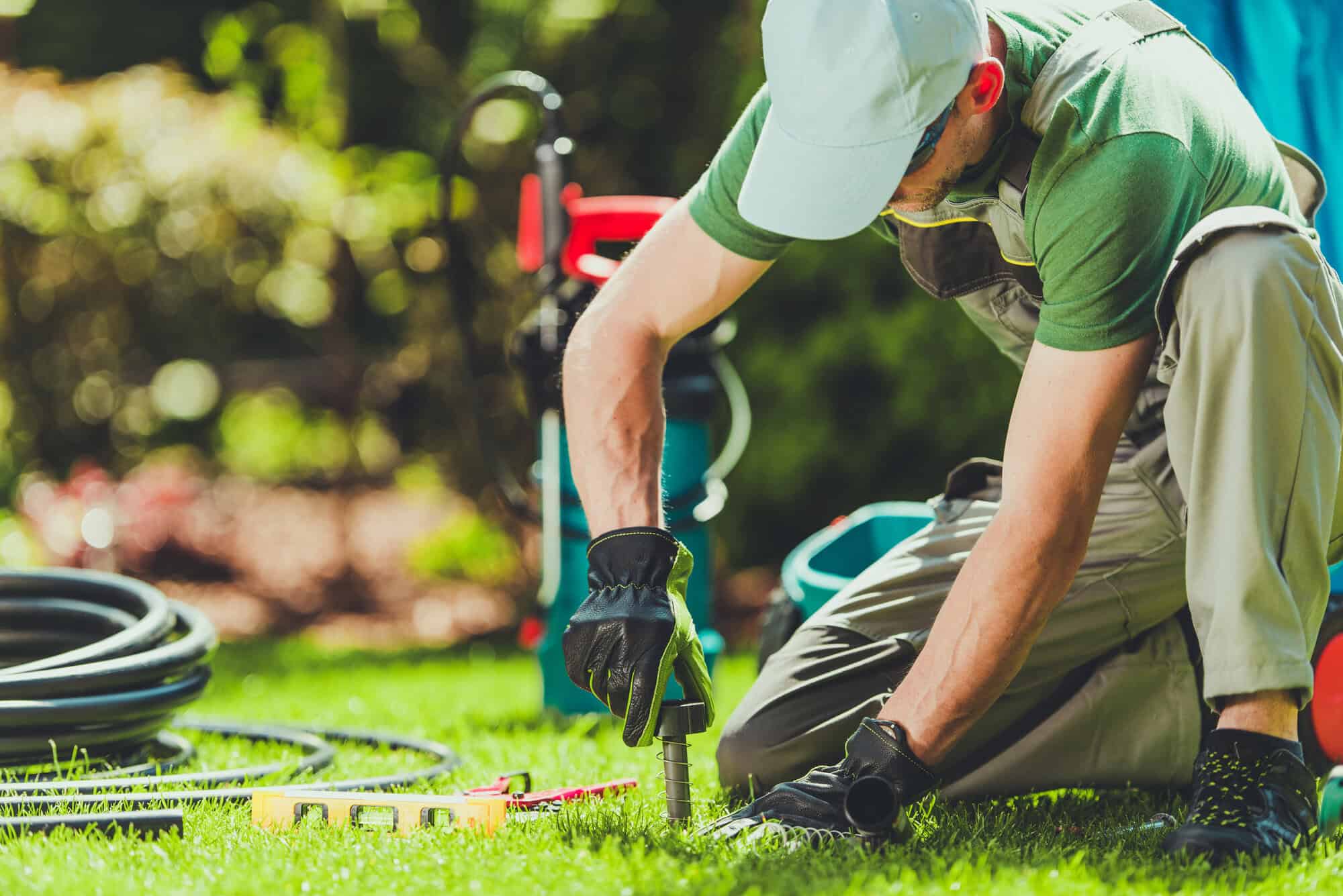 A gardner attending to grass