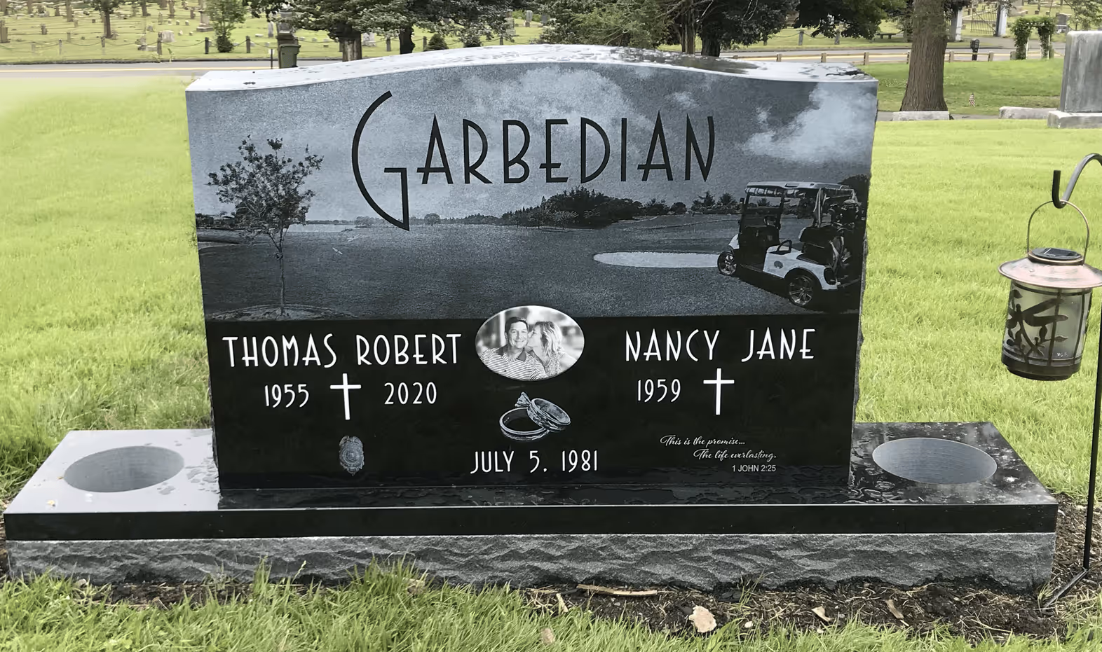 granite monument in a grassy cemetery with etching of a golf course