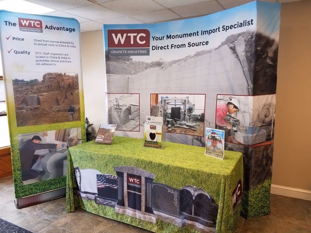 monument company trade show booth with realistic photos of granite monuments