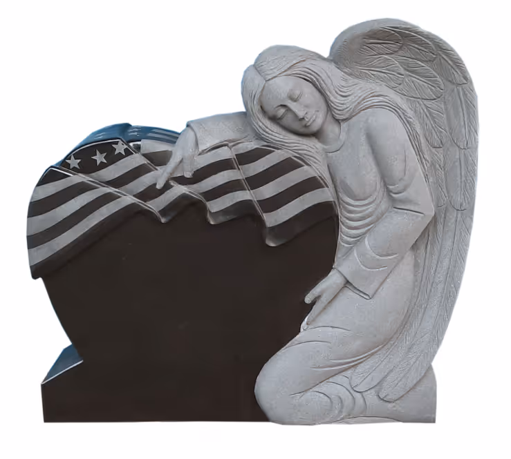 granite monument of an angel with an American flag design on a heart shape