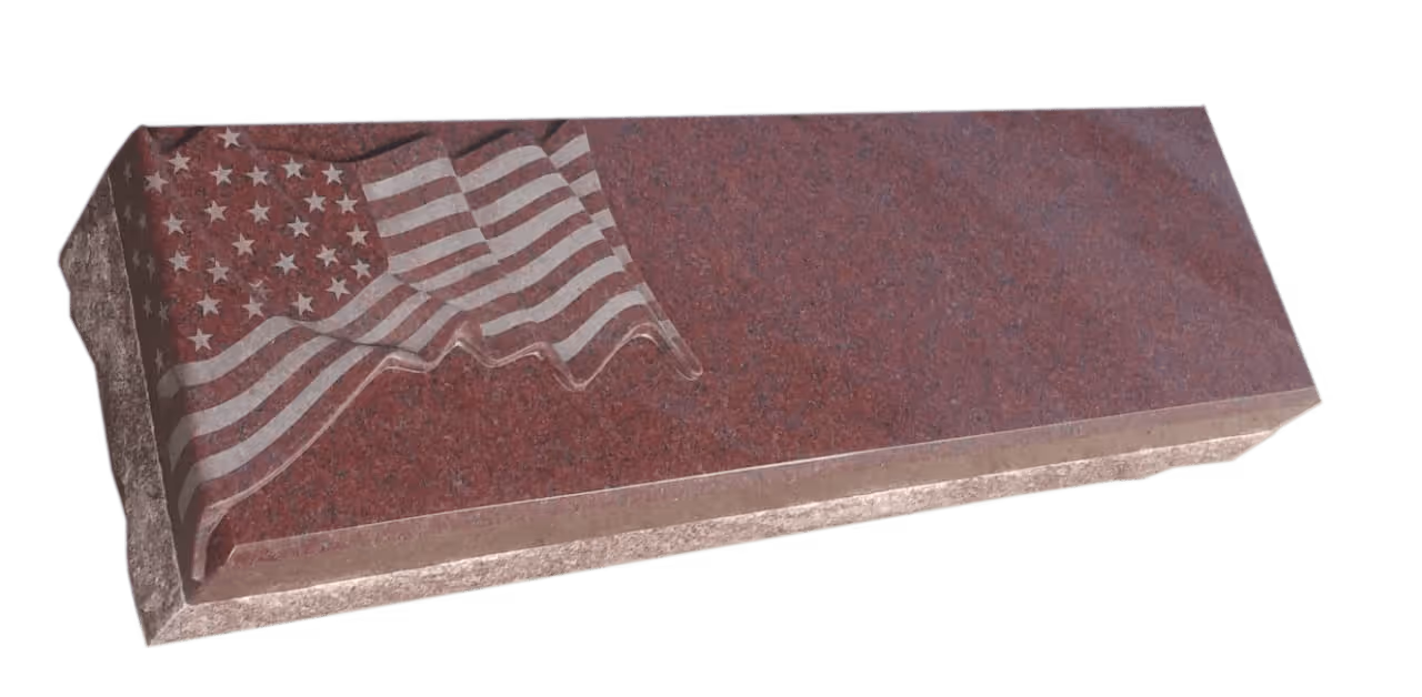 red granite monument with a flag design