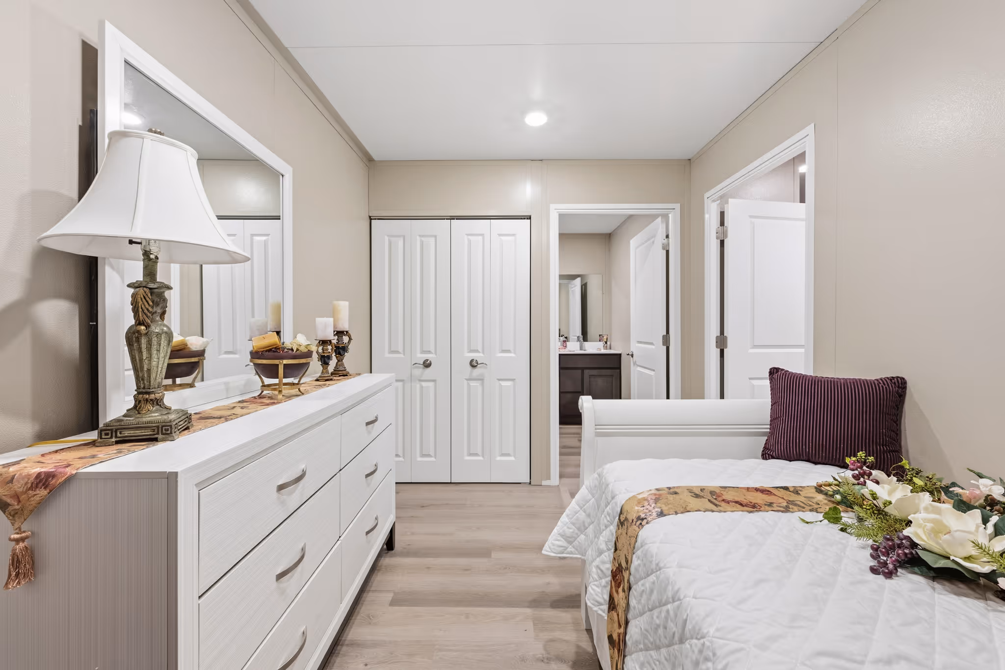 Bedroom with clear pathways and closet and direct bathroom access.