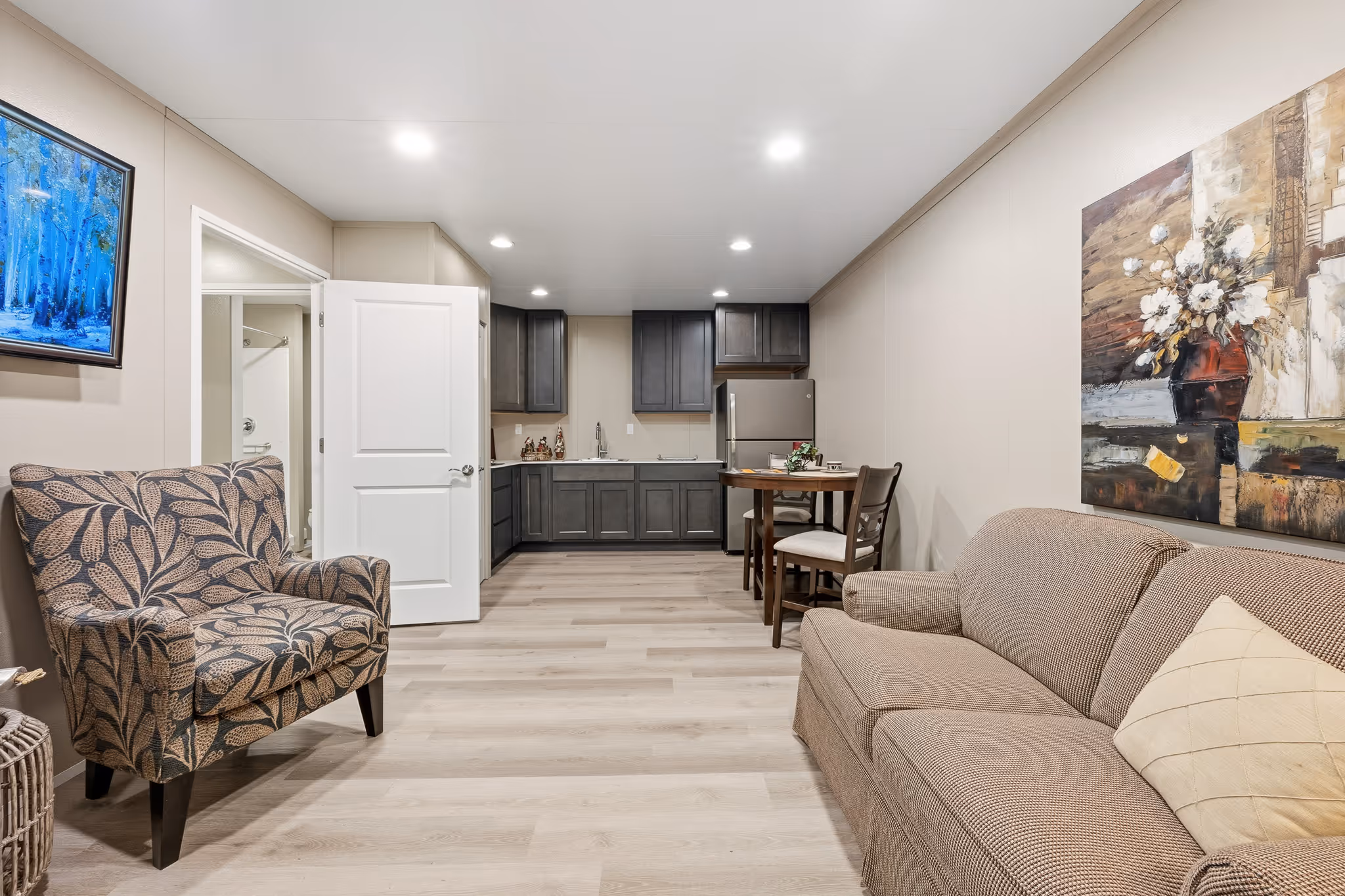 Open living area designed for independent senior living and direct access to kitchenette
