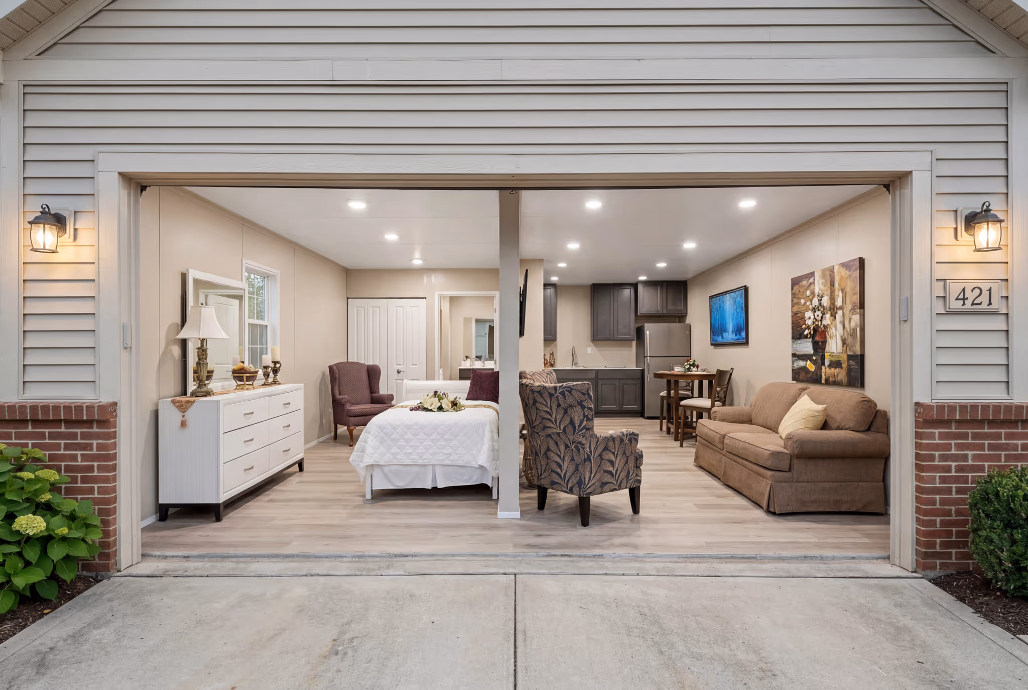 Interior view of a converted garage space designed as a small open living area.