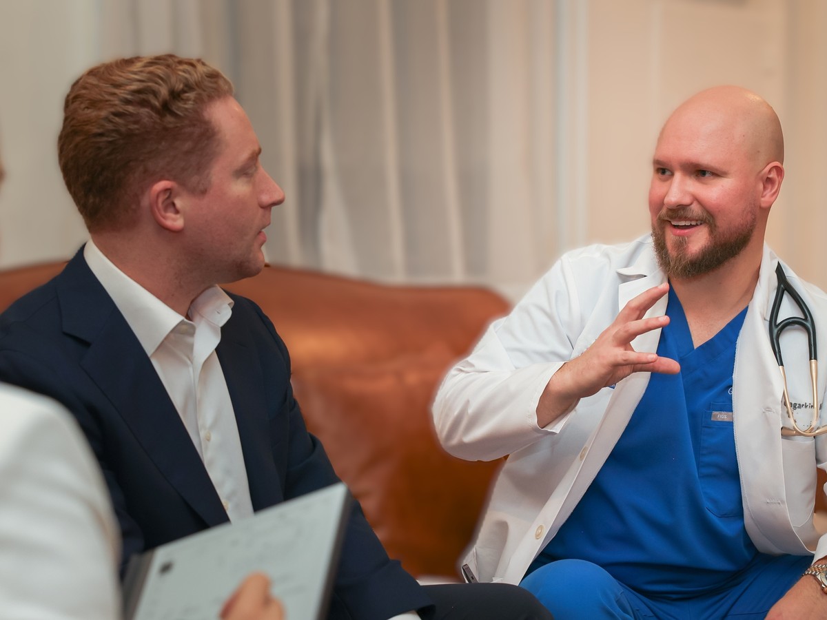 Dr. Gagarkin in an unhurried living-room consultation with patients during a home visit