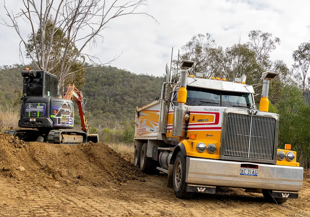 Balint Building & Earthworks excavator and tipper truck providing earthmoving services in Warwick QLD