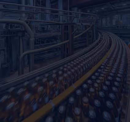 Assembly line in a beverage bottling factory with rows of dark bottles on conveyor belts.