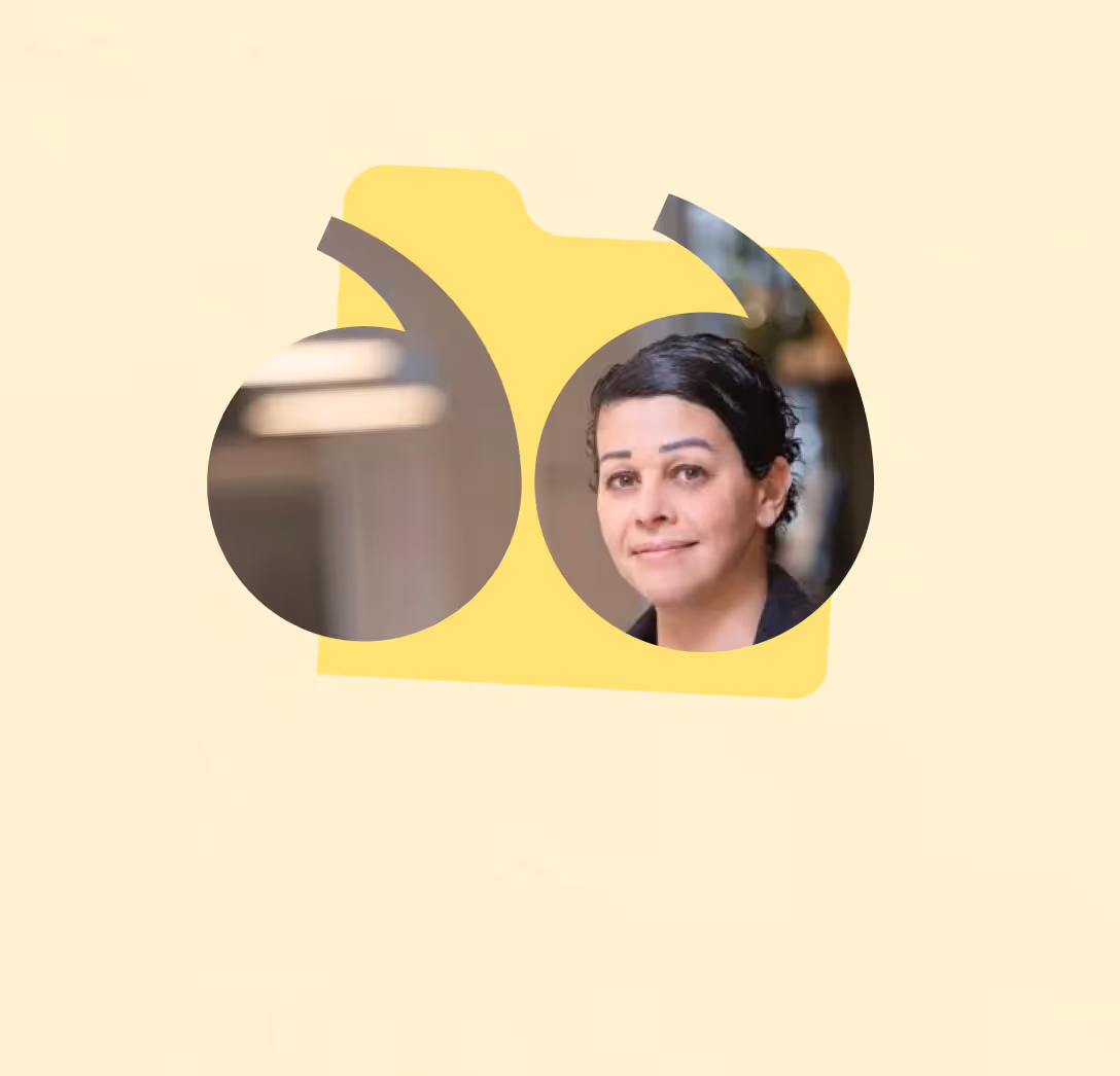 Portrait of a woman with dark hair pulled back, smiling softly, framed inside a yellow quotation mark graphic.