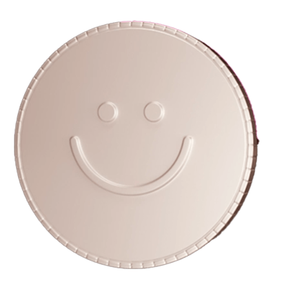 Beige round token with a smiling face embossed on the surface.
