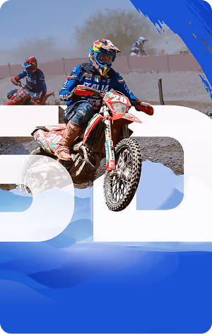 Motocross rider in blue gear on dirt bike jumping over a dirt track with other riders behind.