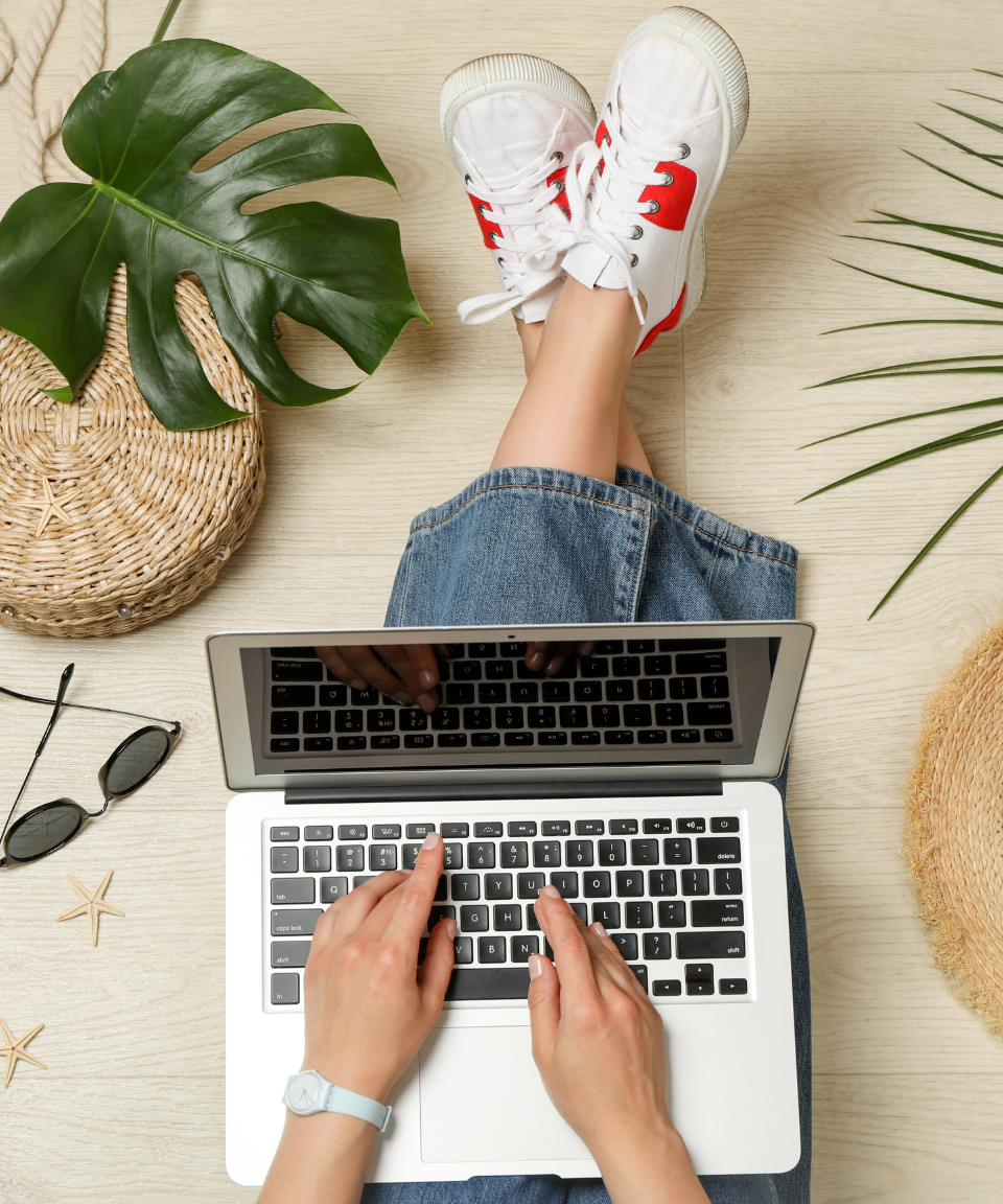 abstract image of person sitting on ground working on laptop