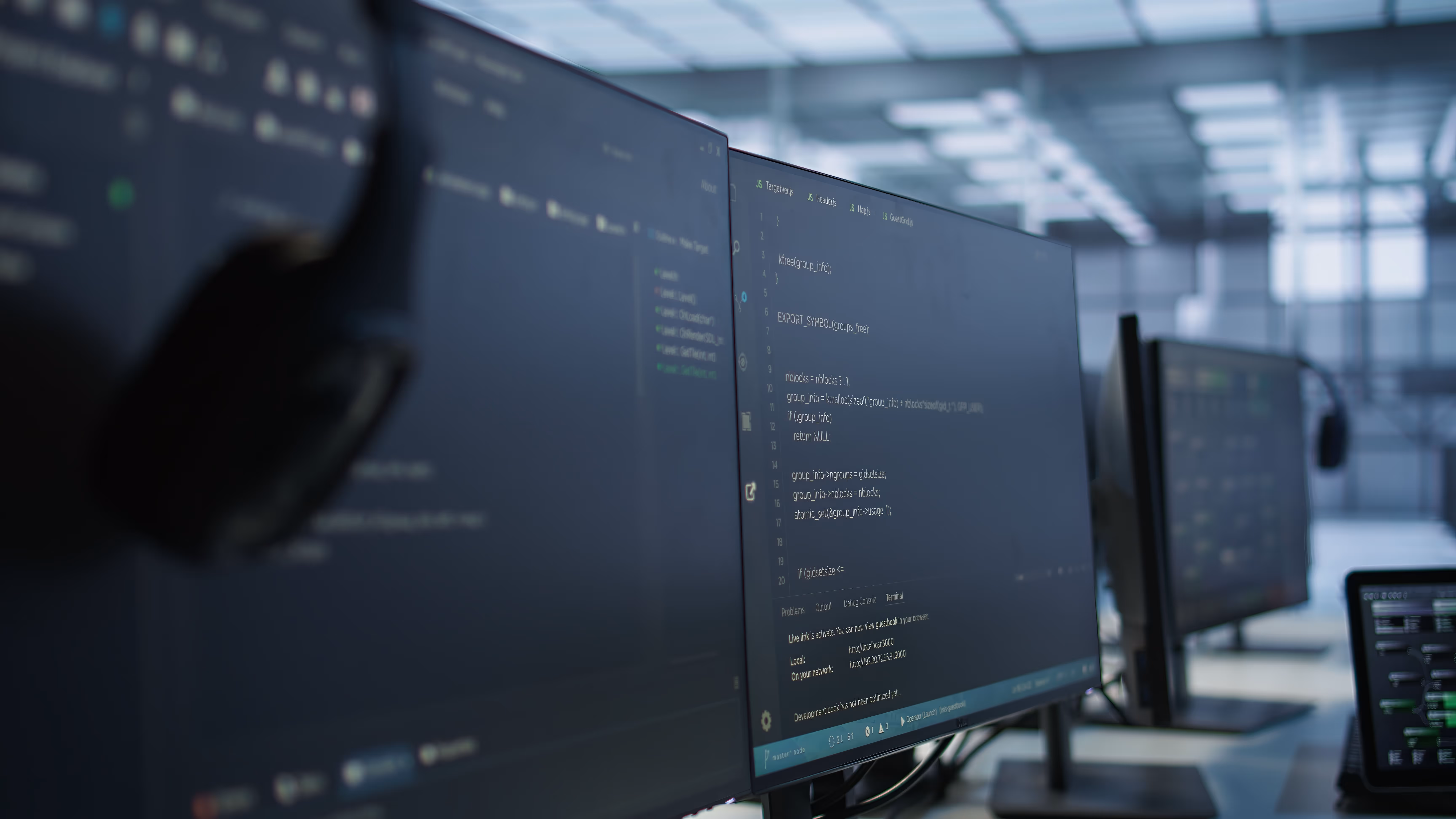 A couple of monitors sitting next to each other.