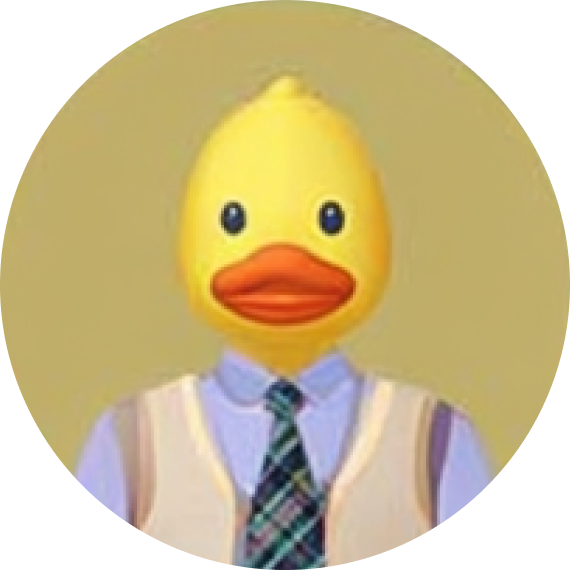 Avatar of a person with a yellow rubber duck head wearing a light blue shirt, beige sweater vest, and green plaid tie.