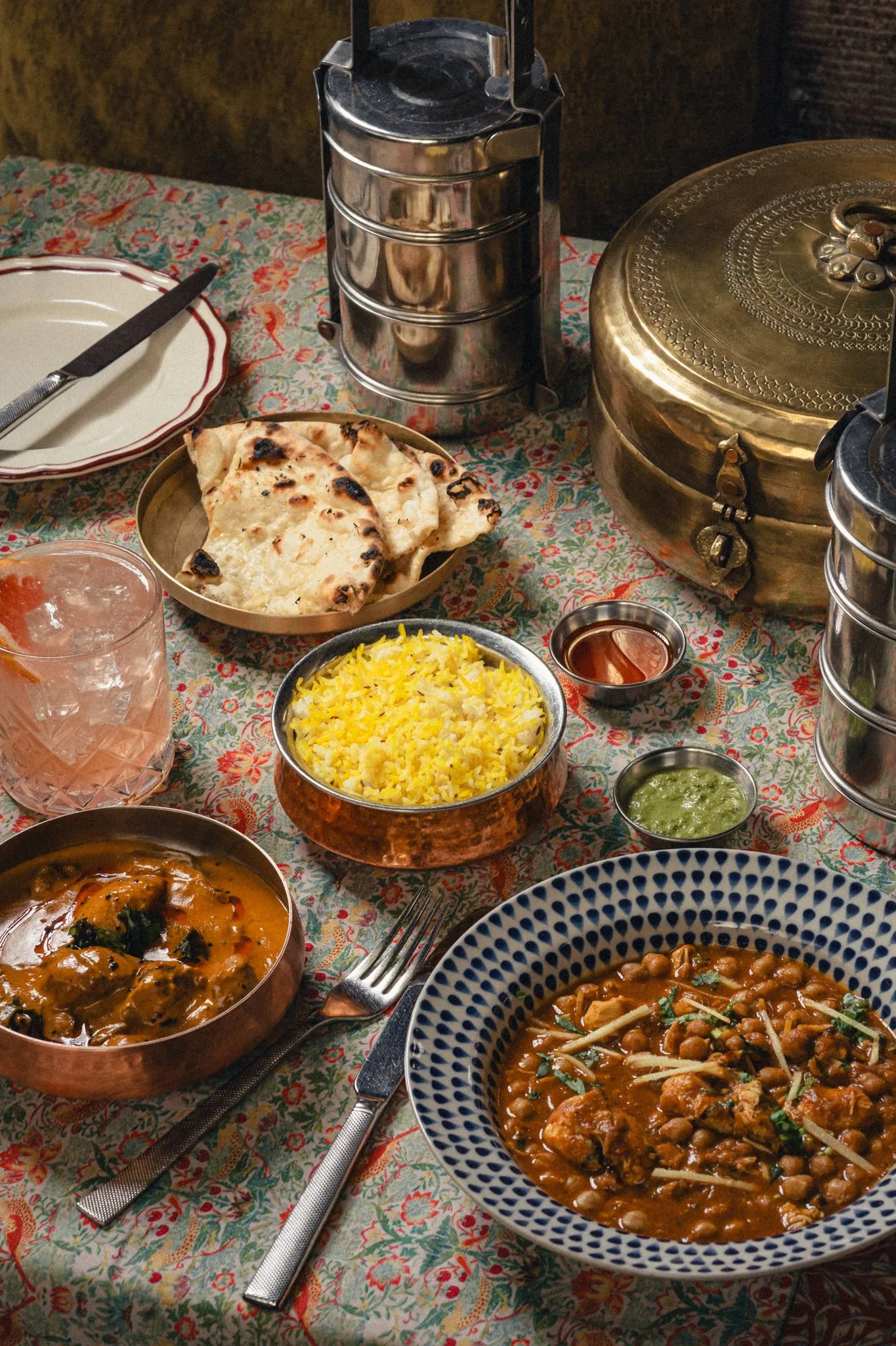 Indian home-style curry, saffron rice, naan and chutneys served with steel tiffins at Dabbawal Newcastle