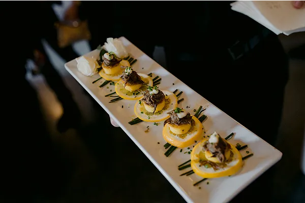 Braised Beef Short Ribs prepared by Bartleby & Sage being passed at an event.
