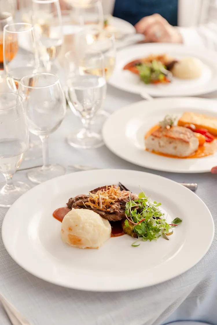 Ribeye steak plated dinner at a wedding catered by Bartleby & Sage