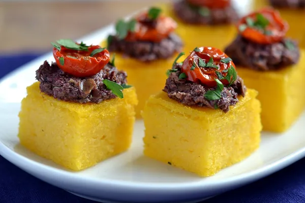 A goat cheese polenta bite served at a Bartleby & Sage event