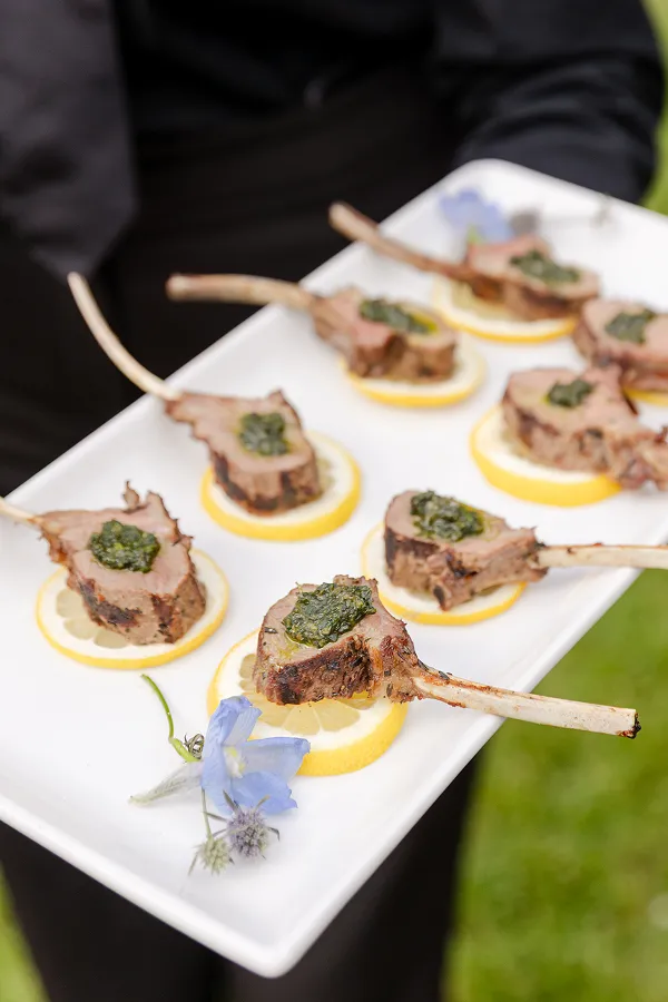 Grilled baby lamb chops plated by Bartleby & Sage