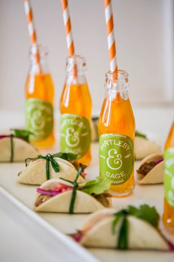 A mini fish taco served alongside cocktails at a Bartleby & Sage event