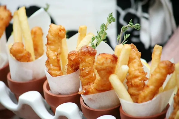 Mini fish and chips served in paper cones at a Bartleby & Sage event