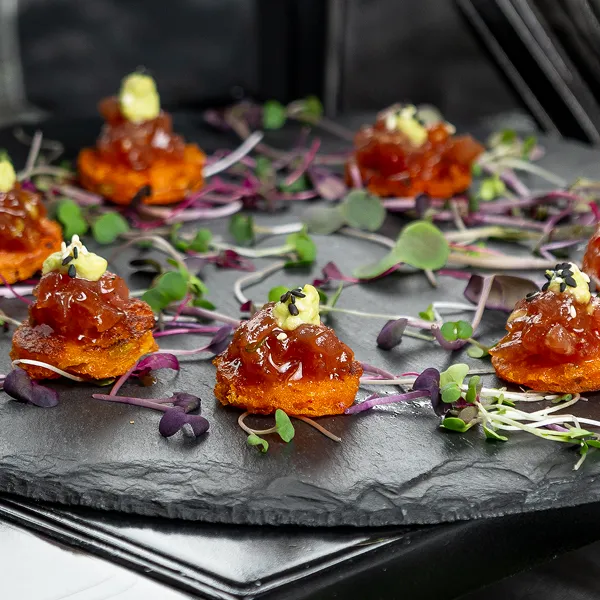 A plated ahi tuna tartare bite, created by the Bartleby & Sage culinary team