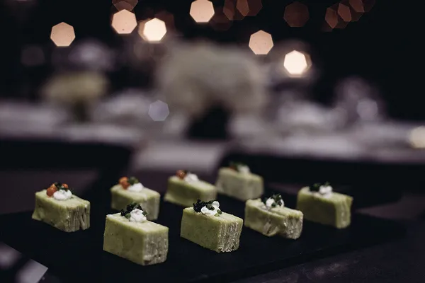 A ten-layer savory crepe served at an event catered by Bartleby & Sage