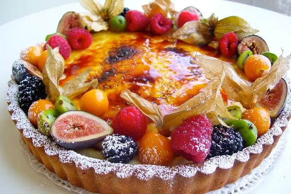 Crème brûlée tart with figs, raspberries, and blackberries, created by the pastry chef at Bartleby & Sage
