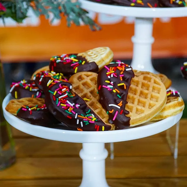 Chocolate-dipped waffle hearts with rainbow sprinkles, created by the pastry chef at Bartleby & Sage
